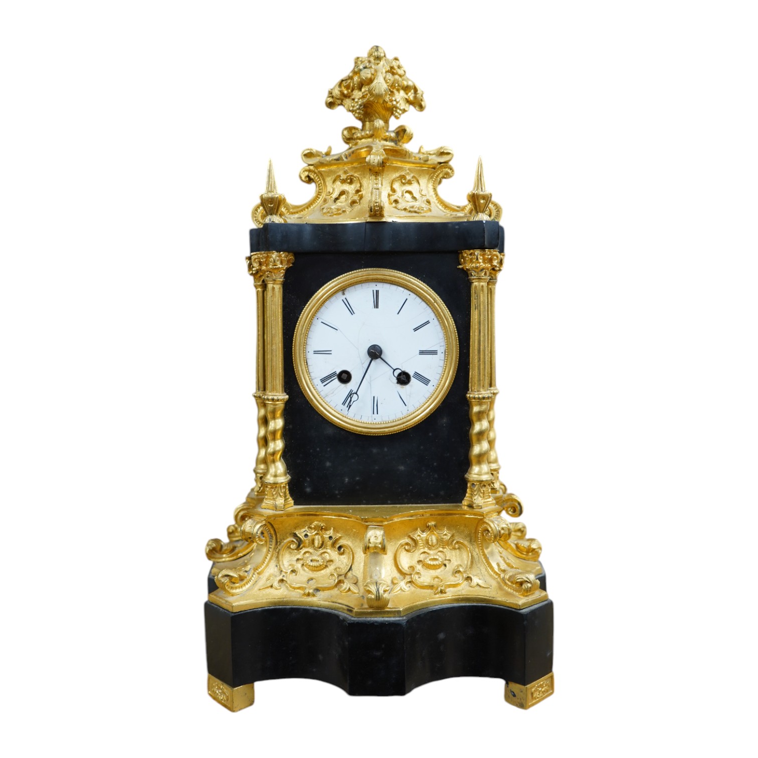 A French ormolu and slate mantle clock with a silk suspension movement, 33cm high. Condition - fair, cracks to the enamel dial.